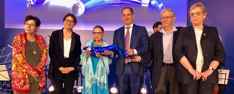 Justice Ruth Bader Ginsburg holds the 2018 Genesis Lifetime Achievement Award alongside Esther Hayut, Chief Justice of the Supreme Court of Israel; Miriam Naor, Aharon Barak, and Dorit Beinisch, former Presidents of the Supreme Court of Israel; and Stan Polovets, Co-Founder and Chairman of The Genesis Prize Foundation. (Photo Credit: Natasha Kuperman)